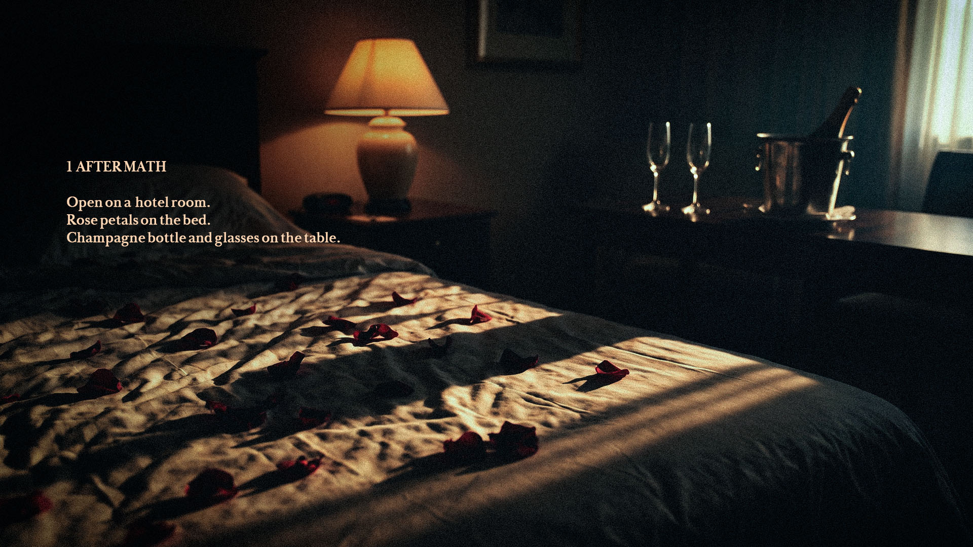 A dimly lit hotel room with rose petals on the bed.